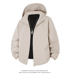 Detailed view of beige windbreaker jacket with metal zipper and elastic cuffs