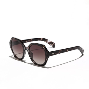Oversized marble texture sunglasses with hexagonal frames and brown gradient lenses