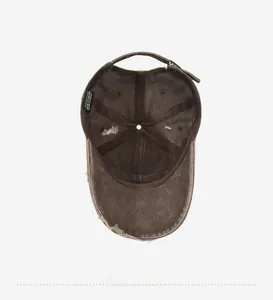 Detail view of cotton baseball cap interior with stitching and distressed brim edge