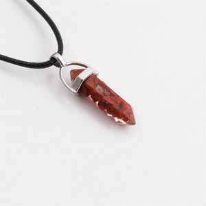 Necklace with red stone hex pillar pendant and silver metal clasp on black cord