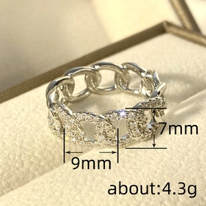 Silver Cuban link ring with micro-pave crystals in jewelry box, 7mm wide band