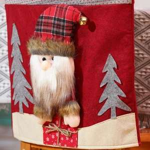 Detailed view of Christmas chair cover with 3D Santa Claus and gray felt tree decor