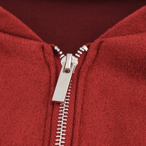 Women's red sleeveless dress featuring a crew neck and sleek front zipper detail
