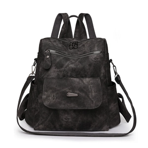 Front view of a vintage dark grey washed canvas backpack with large capacity and straps