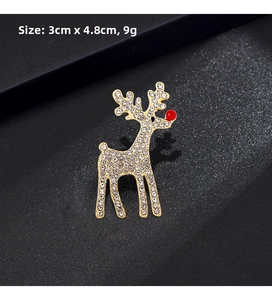 Close-up of a sparkling Christmas reindeer brooch with gold metal and white rhinestones