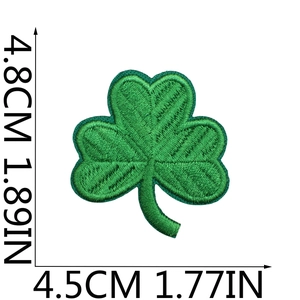 Detailed view of green clover embroidered patch with dimensions 4.8cm by 4.5cm