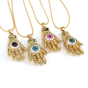 Detailed view of colorful resin evil eye Hamsa hand necklaces with golden ball chains
