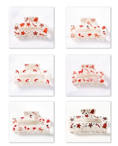 Detail of six cream rectangle hair claws with festive red and brown Christmas patterns
