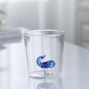 Borosilicate glass cup featuring a cute blue whale sculpture inside the base