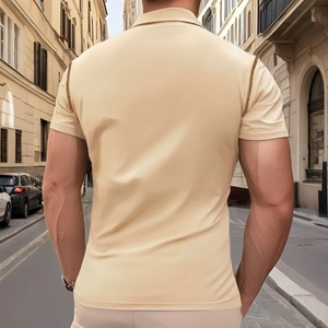 Slim fit men's beige short sleeve Henley shirt shown from the back in a street setting