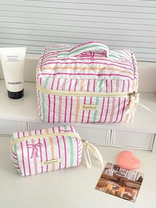 Quilted striped makeup bag set with pink bows featuring large capacity and handle
