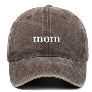 Detailed view of white MOM embroidery on vintage washed cotton baseball cap in dark grey