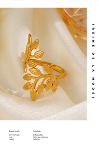 Macro detail of golden leaf ring texture on silk background with soft lighting