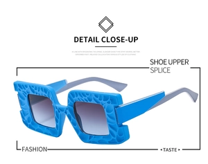 Detail of blue square sunglasses featuring unique geometric hollow texture and gradient lenses