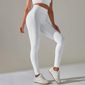 Detail of high waisted seamless ribbed yoga leggings in white with body shaping fit