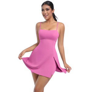 Detail of hot pink athletic dress with side slit showing built-in safety shorts under skirt