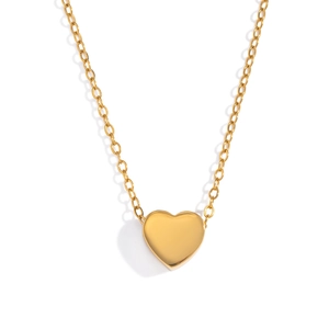 Detailed view of a polished gold heart-shaped pendant on a simple cable chain link