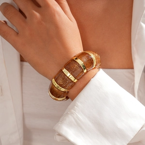 Detailed view of bohemian acrylic stretch bracelet with gold-tone frames and glitter resin
