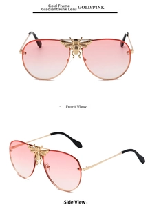 Detailed close-up of gold metal pilot sunglasses featuring a 3D bee ornament and pink lenses