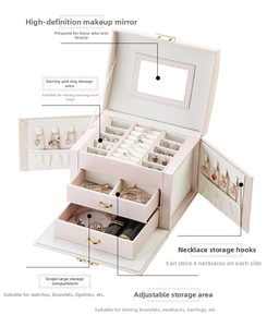 Three-layer pink jewelry box with open side wings and top mirror for storage