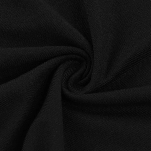 Macro della trama del tessuto a maglia nera con pieghe morbide e flessibili