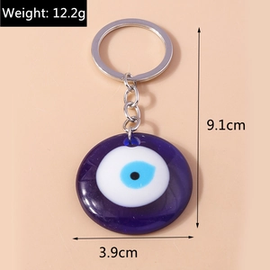 Detailed view of evil eye keychain with measurements 9.1cm height and 12.2g weight
