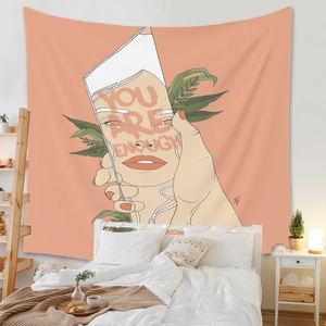 Gros plan détaillé de la tapisserie murale 'YOU ARE ENOUGH' dans une chambre