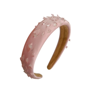 Pink sponge headband with hollow hearts and flowers design for a high cranial top look