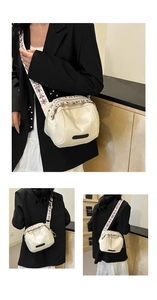 Detail of off-white waterproof nylon bag with ethnic embroidered strap and side view on model