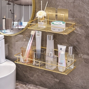 Nordic golden iron bathroom shelves with hollow drainage design on marble wall