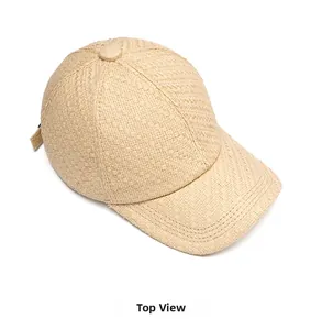 Above view showing the detailed straw weave texture of this beige summer baseball cap