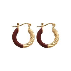 Golden twisted hoop earrings with deep red enamel accents and elegant hinged closure