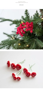 Detail of red foam mushrooms with white dots and green wire stems for Christmas DIY decor
