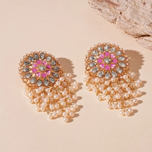 Detail of vintage French palace style earrings with enamel patterns and pearl tassels