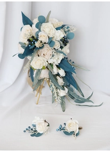 Detailed set of waterfall bridal bouquet and matching boutonnieres with blue greenery
