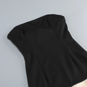 Detailed close-up of a black tube top with slim waistline and smooth fabric texture