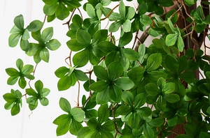 Close-up of realistic emerald green artificial leaves with detailed leaf textures