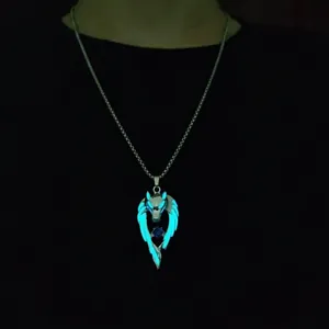 Luminous wolf totem wing pendant necklace with blue gemstone and glow effect