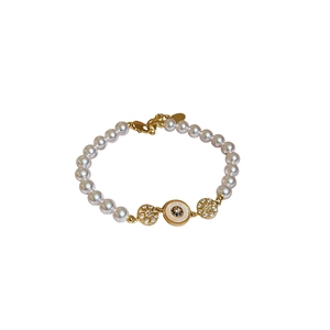 Bracelet en perles plaqué or 18k avec breloque œil bleu et motifs solaires bohèmes