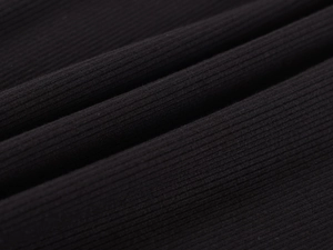 Close-up of the black ribbed knit fabric showing the soft texture and striped pattern