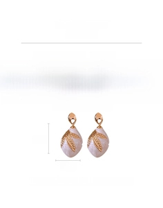 Detail of pink marble drop earrings with gold leaf overlay measuring 5.8cm long