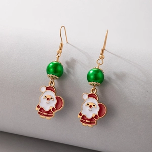 Detailed view of Santa Claus enamel earrings with green pearls and golden hooks
