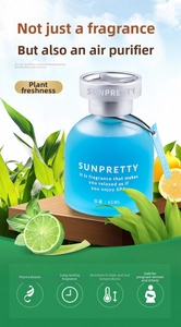 Detail of 65ml liquid car air freshener bottle on wood base with citrus and fresh green leaves