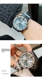 Detail of light blue sunray dial watch with rhinestone bezel and numeric markers