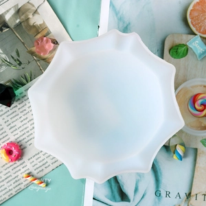 Top view of a white translucent star-shaped silicone mold for DIY resin crafts