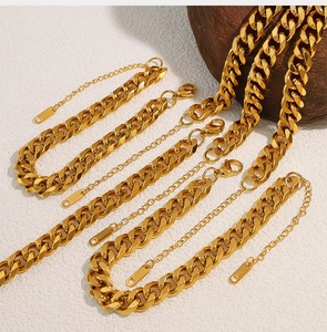 Detail of 18K gold-plated stainless steel Cuban link bracelet with lobster clasp and tag
