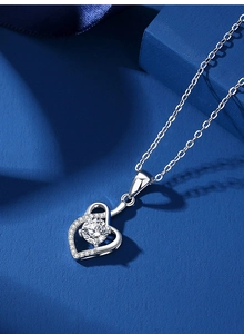 Macro shot of s925 sterling silver heart pendant necklace with shimmering moissanite
