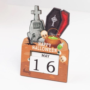 Detail of wooden Halloween countdown calendar featuring tombstone and skull graphics