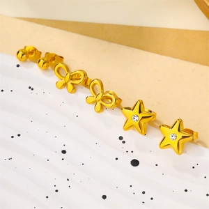 Elegant gold earring set featuring spherical, bow, and sparkling star designs