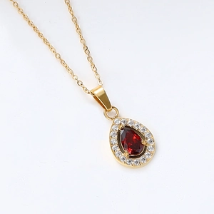Detail of water drop red zircon pendant with 18K gold plated stainless steel chain